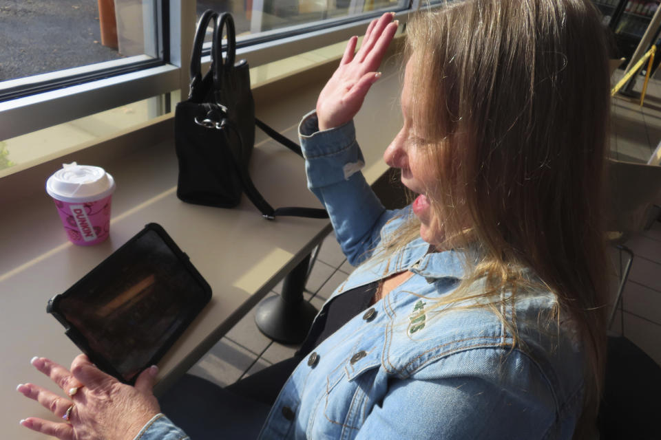 FILE - Elaine Vallaster reacts to a winning spin while playing an internet slots game on her tablet in Hazlet, N.J. on Friday, Nov. 24, 2023. Internet gambling is currently offered in seven states but has been slow to catch on more widely in the U.S. (AP Photo/Wayne Parry, File)