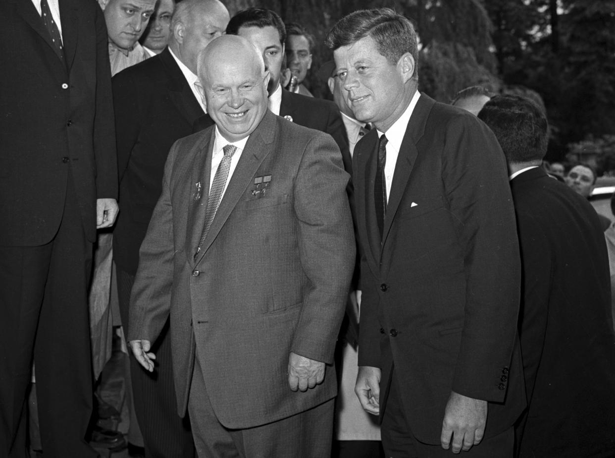 Soviet Premier Nikita Khrushchev walks with U.S. President John F. Kennedy at the residence of the U.S. ambassador in Vienna, Austria on June 3, 1961. 