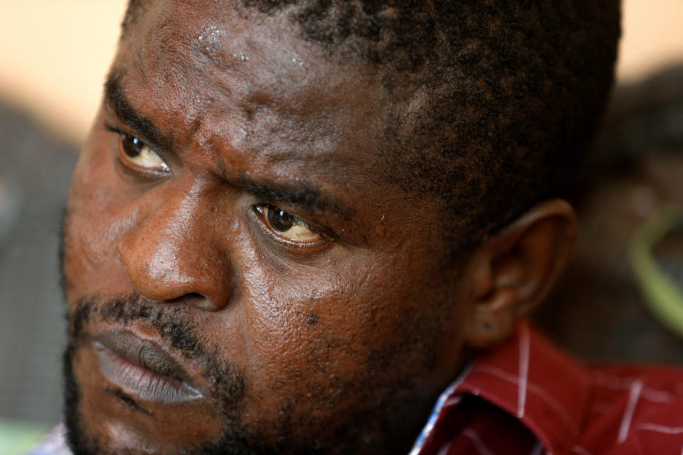 FILE - Barbecue, whose real name is Jimmy Cherizier, sits at his house during an interview with AP, in Lower Delmas, a district of Port-au-Prince, Haiti, May 24, 2019. The U.N. Security Council unanimously adopted a resolution Friday, Oct. 21, 2022 demanding an immediate end to violence and criminal activity in Haiti and imposing sanctions on Barbecue, a powerful gang leader. (AP Photo/Dieu Nalio Chery, File)