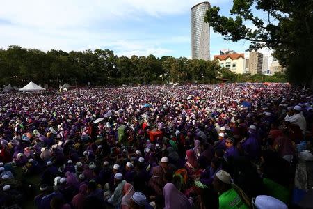 Supporters attend a rally to support the adoption of a strict Islamic penal code at Padang Merbok in Kuala Lumpur, Malaysia, February 18, 2017. REUTERS/Athit Perawongmetha