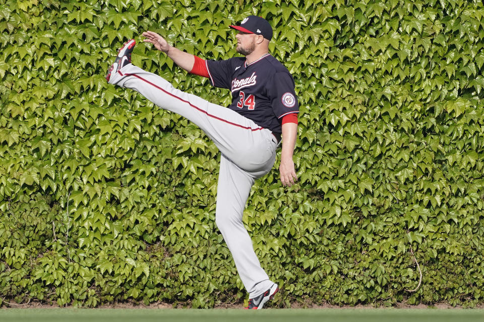 Washington Nationals starting pitcher Jon Lester stretches before a baseball game against the Chicago Cubs Monday, May, 17, 2021, in Chicago. (AP Photo/David Banks)