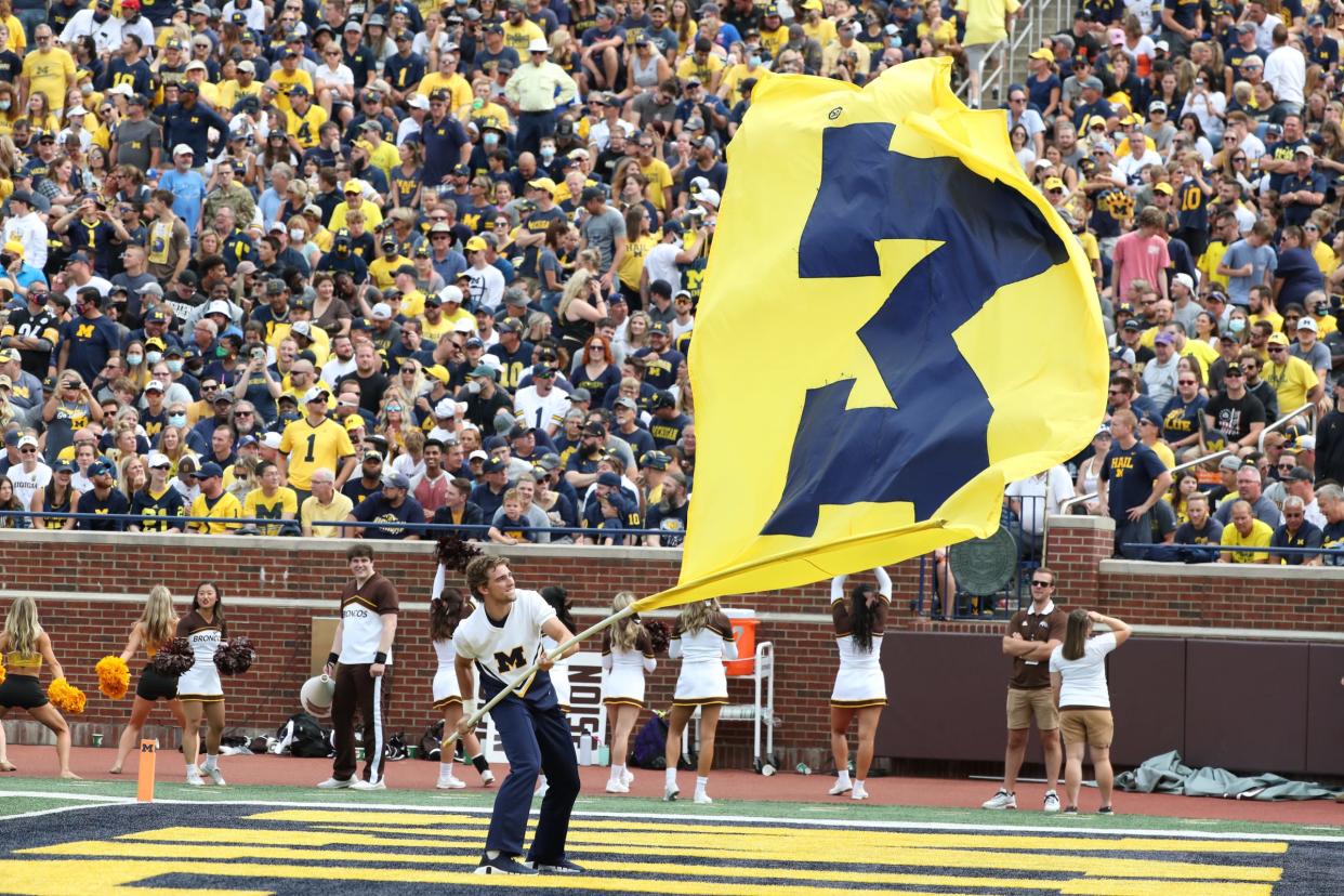 Michigan Wolverines fans celebrate a touchdown against the Western Michigan Broncos Saturday, Sept. 4, 2021.