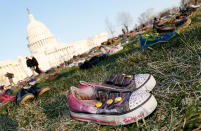 <p>7,000 empty pairs of shoes for every child killed by guns in the US since Sandy Hook cover the southeast lawn of U.S. Capitol Building on Tuesday, March 13, 2018 in Washington, D.C. Avaaz gathered survivors, family members, and dozens of volunteers to create the installation calling on Congress to honor kids’ lives with gun reform laws. (Photo: Paul Morigi/AP Images for AVAAZ) </p>