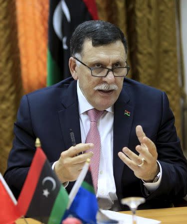 Fayez Seraj, Libyan prime minister-designate under the proposed unity government, attends a meeting with officials of municipal council of Tripoli in Tripoli, Libya, March 31, 2016. REUTERS/Ismail Zitouny