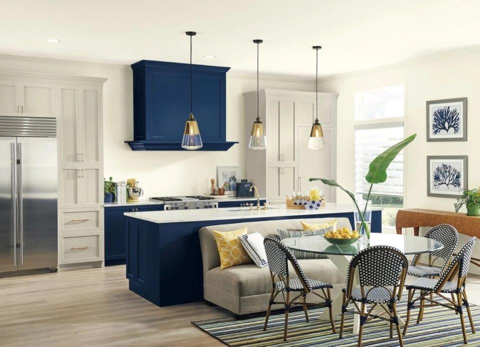 Kitchen painted in Sherwin-Williams' Pure White, with navy cabinets.