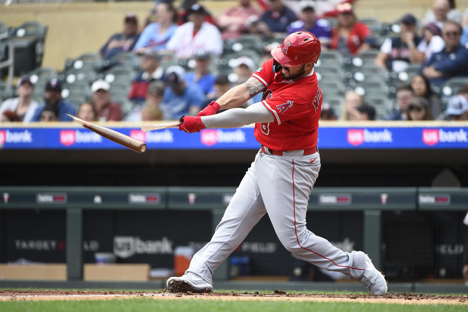 Los Angeles Angels' Mike Moustakas hits a broken-bat single against Minnesota Twins pitcher Joe Ryan during the fourth inning of a baseball game Sunday, Sept. 24, 2023, in Minneapolis. (AP Photo/Craig Lassig)