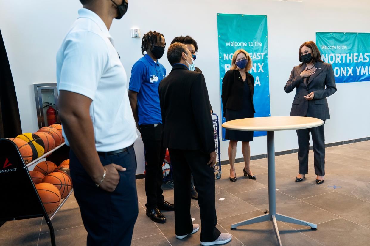 Vice President Kamala Harris, right, speaks to Sharon Greenberger, President & CEO of the YMCA of Greater New York, and staff members of at the Northeast Bronx YMCA, in the Bronx borough of New York, Friday, Oct. 22, 2021.