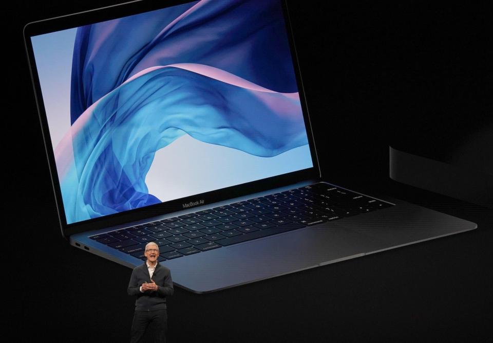 Apple CEO Tim Cook presents new products, including new Macbook laptops, during a special event at the Brooklyn Academy of Music: TIMOTHY A. CLARY/AFP/Getty Images