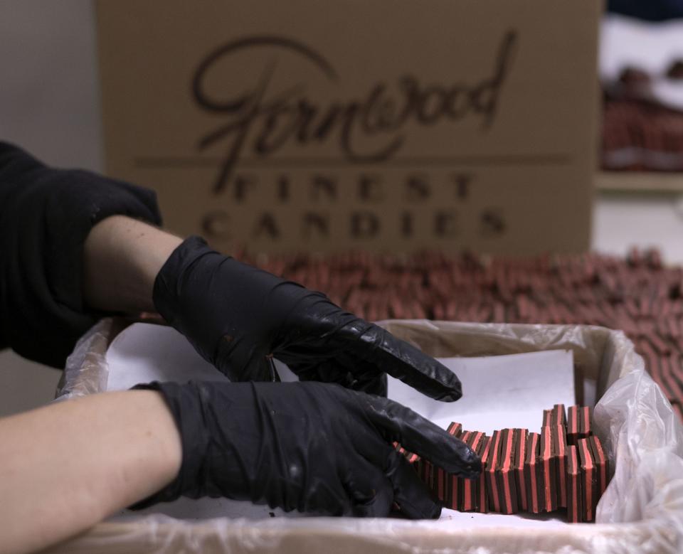 Chocolate sandwiches are hand packed into boxes at Fernwood Candy Company in Logan on Thursday, Nov. 30, 2023. | Laura Seitz, Deseret News