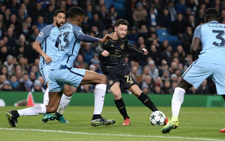 Celtic's midfielder Patrick Roberts (C) scores his team's first goal during the UEFA Champions League group C football match between Manchester City and Celtic at the Etihad Stadium in Manchester, northern England, on December 6, 2016