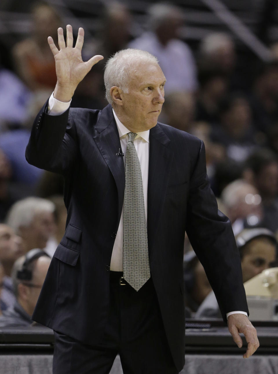 San Antonio Spurs coach Gregg Popovich signals to his players during the first half of Game 2 of the opening-round NBA basketball playoff series against the Dallas Mavericks, Wednesday, April 23, 2014, in San Antonio. (AP Photo/Eric Gay)