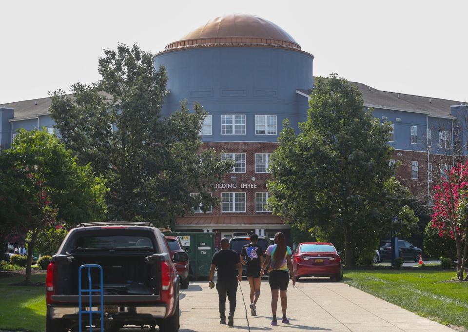 Cars, SUVS, pickups and even rental vans line the sidewalks as upperclassmen move in to the University Village housing on the Delaware State University campus in Dover, Saturday, August 26, 2023.