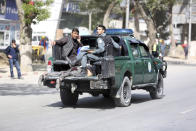 <p>Afghan security personnel carry a victim after the second blast in Kabul, Afghanistan, April 30, 2018. (Photo: Rahmat Gul/AP) </p>