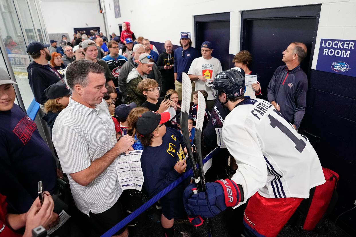 Jul 2, 2023; Columbus, Ohio, USA;  Adam Fantilli (11) signs autographs and takes photos following the first day of the Columbus Blue Jackets development camp at the OhioHealth Chiller North in Lewis Center. 