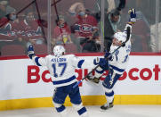 Tampa Bay Lightning's Ondrej Palat, right, celebrates his goal against the Montreal Canadiens with Alex Killorn during the third period of an NHL hockey game Tuesday, Dec. 7, 2021, in Montreal. (Paul Chiasson/The Canadian Press via AP)