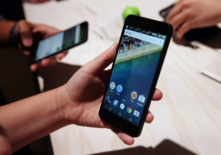 An attendee inspects the new Nexus 5X phone during a Google media event on September 29, 2015 in San Francisco, California