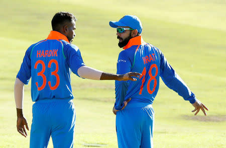 Cricket - India v South Africa - Third One Day International - Newlands Stadium, Cape Town, South Africa - February 7, 2018. India's Hardik Pandya confers with captain Virat Kohli. REUTERS/Mike Hutchings