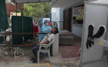 A health worker takes a nasal swab sample to test for COVID-19 in Hyderabad, India, Tuesday, Sept. 29, 2020. India confirmed coronavirus tally has reached 6 million cases, keeping the country second to the United States in number of reported cases since the pandemic began. (AP Photo/Mahesh Kumar A.)