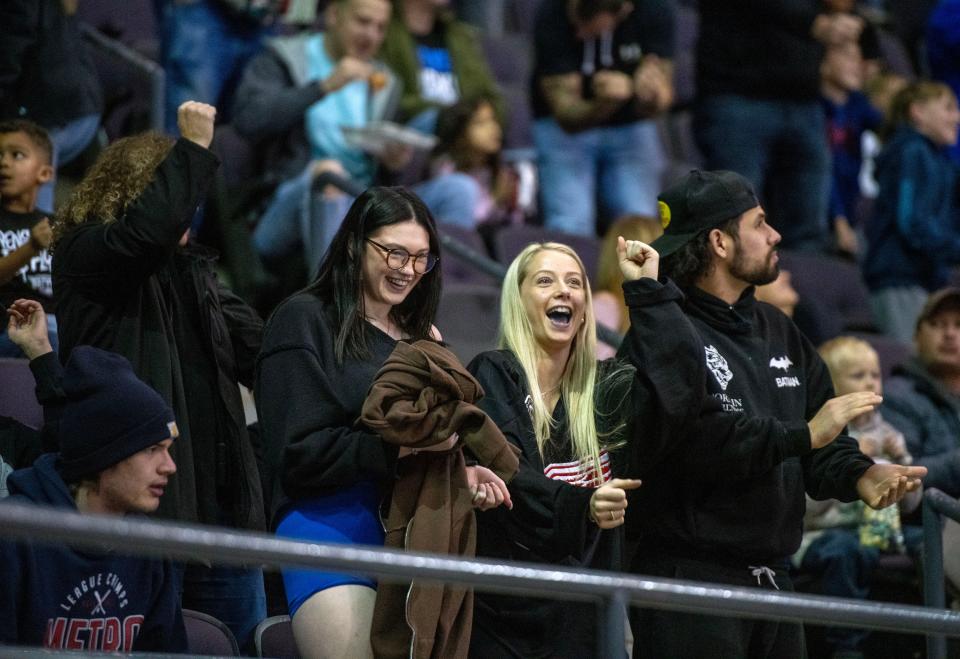 Pensacola Ice Flyers fans celebraate after a goal against the Birmingham Bulls at the Pensacola Bay Center Saturday, December 30, 2023.