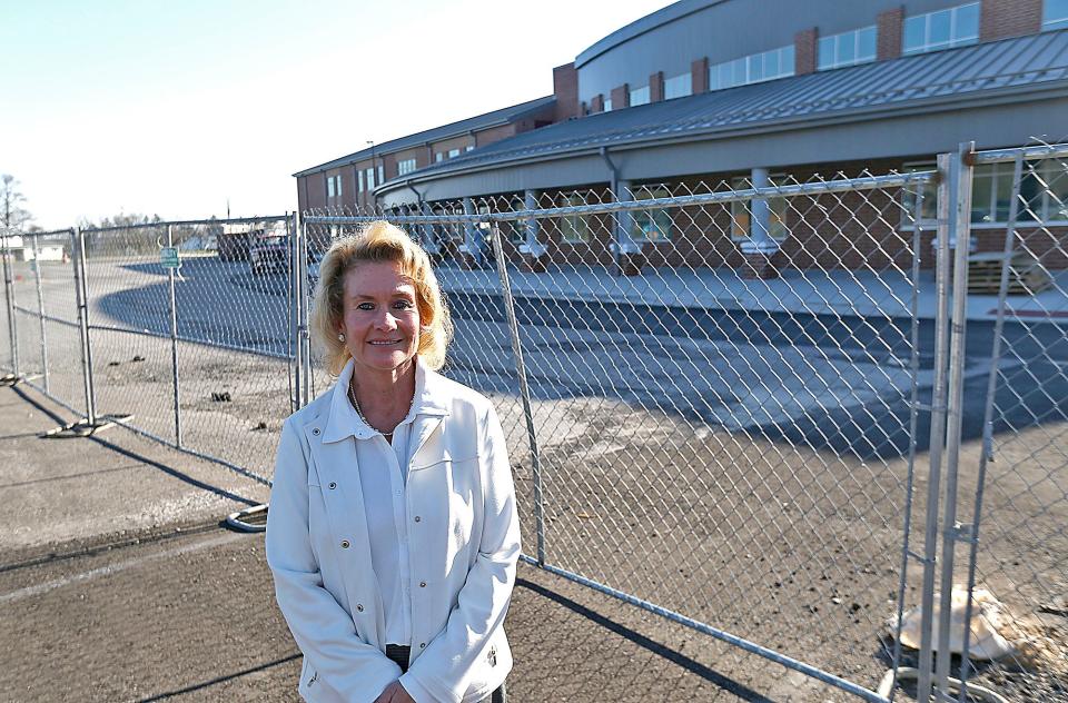 Hillsdale Local School's new superintendent Catherine Trevathan poses in front of the new school being built on the Hillsdale campus on Thursday, April 13, 2023. TOM E. PUSKAR/ASHLAND TIMES-GAZETTE