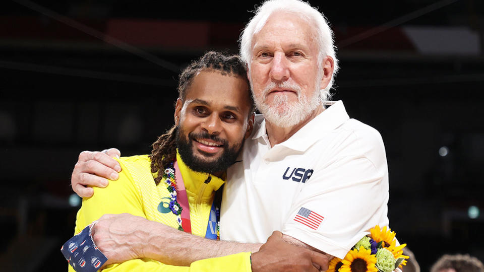 Pictured here, Aussie star Patty Mills and Team USA coach Gregg Popovich embrace at the Olympics.