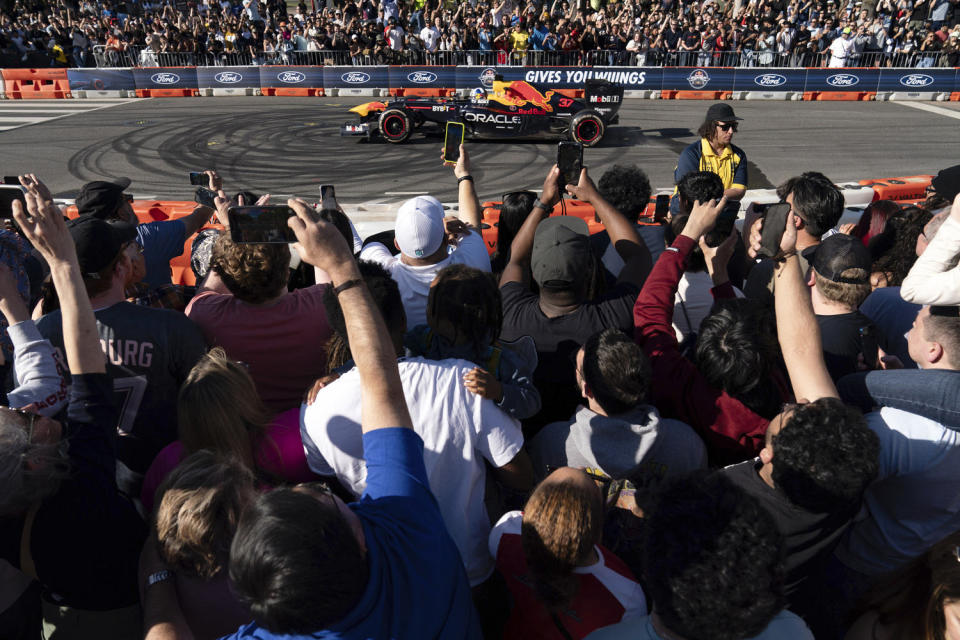 Grand Prix-winning driver David Coulthard drives the RB7 racing car that won the 2011 Formula One championship during a demonstration along Pennsylvania Avenue in Washington, Saturday, April 20, 2024.  (Jose Luis Magana / AP)