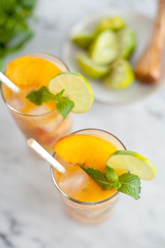 <p>Just Putzing</p><p>This ginger peach mojito mocktail is fruity, tart, bubbly and fresh, with a bit of a spicy ginger kick on the back end.</p><p><strong>Get the recipe: <a href="https://www.justputzing.com/2014/07/thirsty-thursdays-ginger-peach-mojito-mocktail.html" rel="nofollow noopener" target="_blank" data-ylk="slk:Ginger Peach Mojito Mocktail;elm:context_link;itc:0;sec:content-canvas" class="link ">Ginger Peach Mojito Mocktail</a></strong></p>