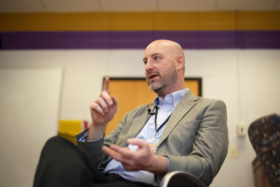 Upper Darby High School Principal Matthew Alloway gestures while speaking with a reporter during an interview, Wednesday, April 12, 2023, in Drexel Hill, Pa. For some schools, the pandemic allowed experimentation to try new schedules. Large school systems including Denver, Philadelphia and Anchorage, Alaska, have been looking into later start times.(AP Photo/Matt Slocum)