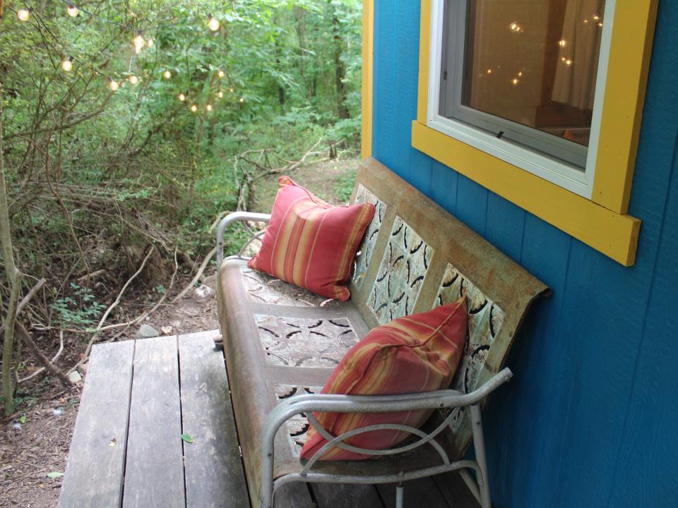 a bench outside the tiny house