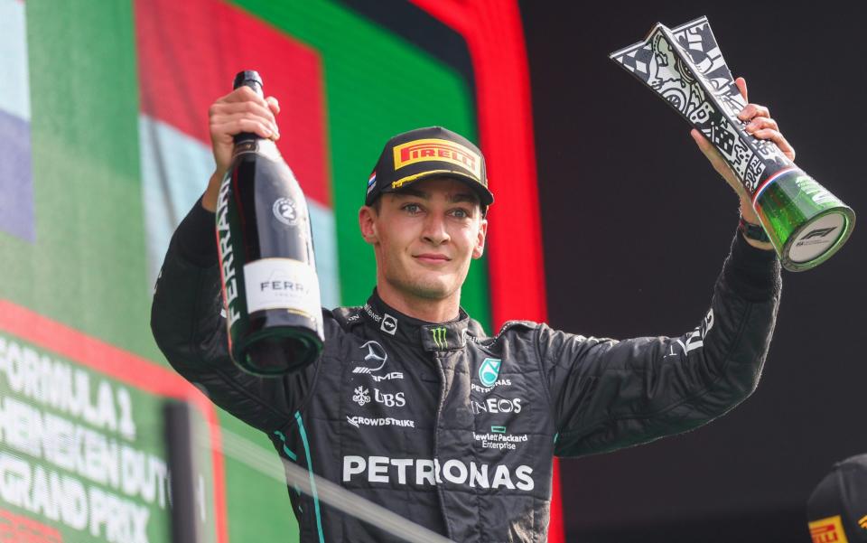 George Russell celebrates on the podium after finishing second in the Dutch Grand Prix - GETTY