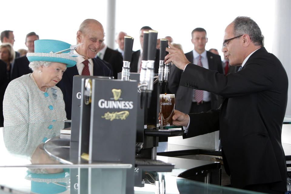 DUBLIN, IRELAND - MAY 18:  Queen Elizabeth II and Prince Philip, Duke of Edinburgh visit the Guinness Storehouse and watch the pouring of a pint on May 18, 2011 in Dublin, Ireland. The Duke and Queen's visit to Ireland is the first by a monarch since 1911. An unprecedented security operation is taking place with much of the centre of Dublin turning into a car free zone. Republican dissident groups have made it clear they are intent on disrupting proceedings.  (Photo by Irish Government - Pool/Getty Images)