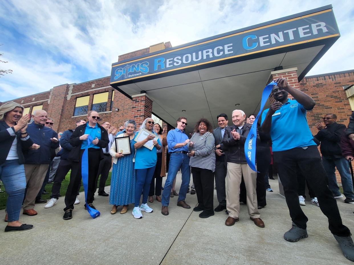 The ribbon is cut during a formal celebration for the SONS Outreach Resource Center, 55 15th St., on Tuesday, April 16, 2024, in Port Huron.