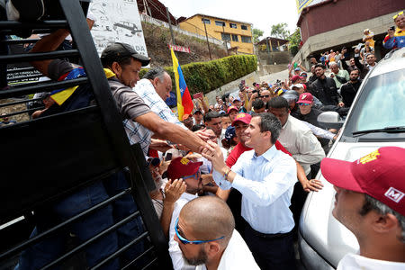 Venezuelan opposition leader Juan Guaido, who many nations have recognised as the country's rightful interim ruler, attends a rally in Carrizal, Venezuela, March 30, 2019. REUTERS/Ivan Alvarado