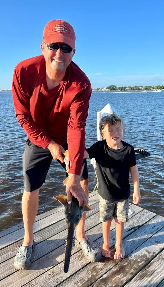 Retired Cleveland Clinic Martin Health CEO Rob Lord, and his 5-year-old grandson, caught and released this critically endangered smalltooth sawfish in the south fork of the St. Lucie River on Saturday, July 30, 2022. It's the 13th sawfish reported in the river so far this year, according to the Florida Fish and Wildlife Conservation Commission.