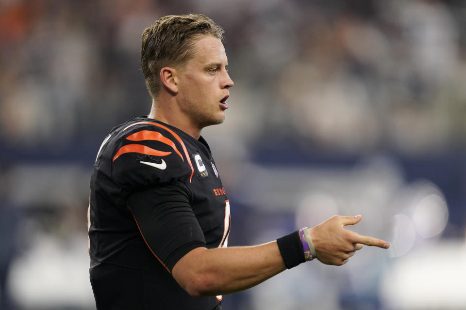 Cincinnati Bengals quarterback Joe Burrow (9) celebrates a two point conversion during the second half of an NFL football game against he Dallas Cowboys Sunday, Sept. 18, 2022, in Arlington, Tx. (AP Photo/Tony Gutierrez)