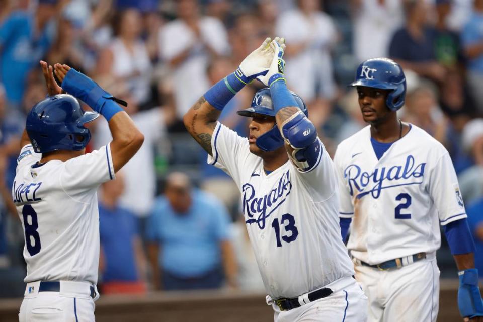 Salvador Perez (13) is congratulated by Royals teammates Nicky Lopez (8) and Michael A. Taylor (2) after one of his 48 home runs this season.