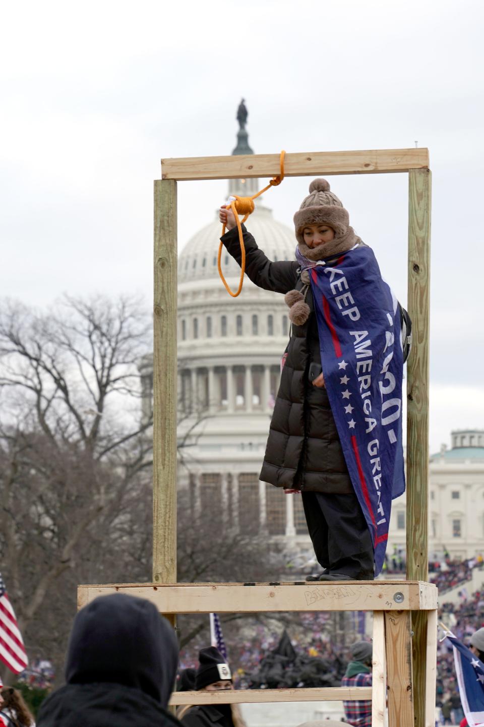 A Trump supporter holds up a noose at the "Stop the Steal" rally outside the U.S. Capitol on Jan. 6.