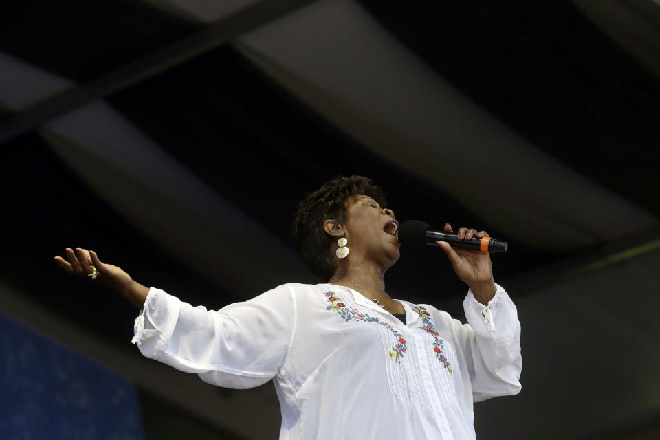FILE - In this May 5, 2013 file photo, Irma Thomas performs at the New Orleans Jazz and Heritage Festival in New Orleans. Thomas has been a regular performer at the New Orleans Jazz & Heritage Festival since 1974, and is playing the festival again this year. (AP Photo/Gerald Herbert, File)