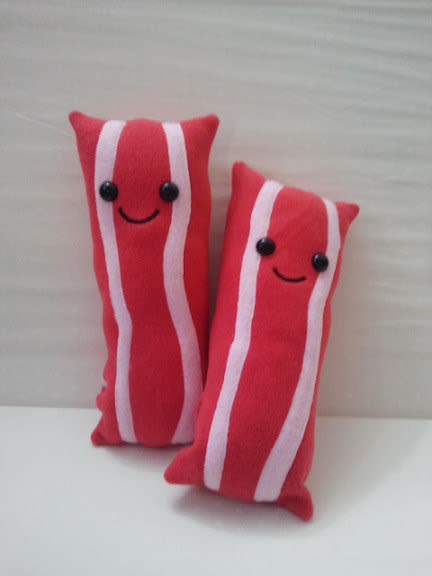 Who couldn't use some happy, little bacon to brighten your day?  <a href="http://www.etsy.com/listing/96658166/big-happy-bacon-plush?ref=sr_gallery_9&ga_search_query=bacon&ga_view_type=gallery&ga_ship_to=US&ga_page=5&ga_search_type=all">Etsy</a>, <strong>$20</strong>