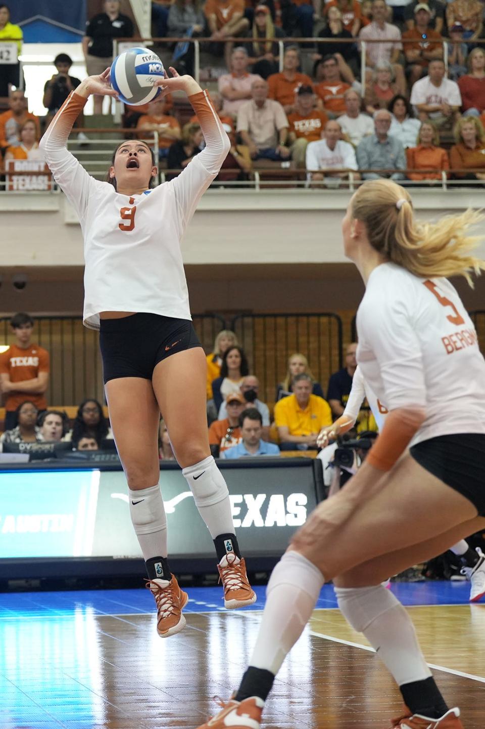Texas setter Saige Ka'aha'aina-Torres sets up a teammate during the 3-1 win over Marquette in the Sweet 16. "Before, I was kind of out there gunslinging," she said. "This year watching film, I feel like I understand the game so much more."
