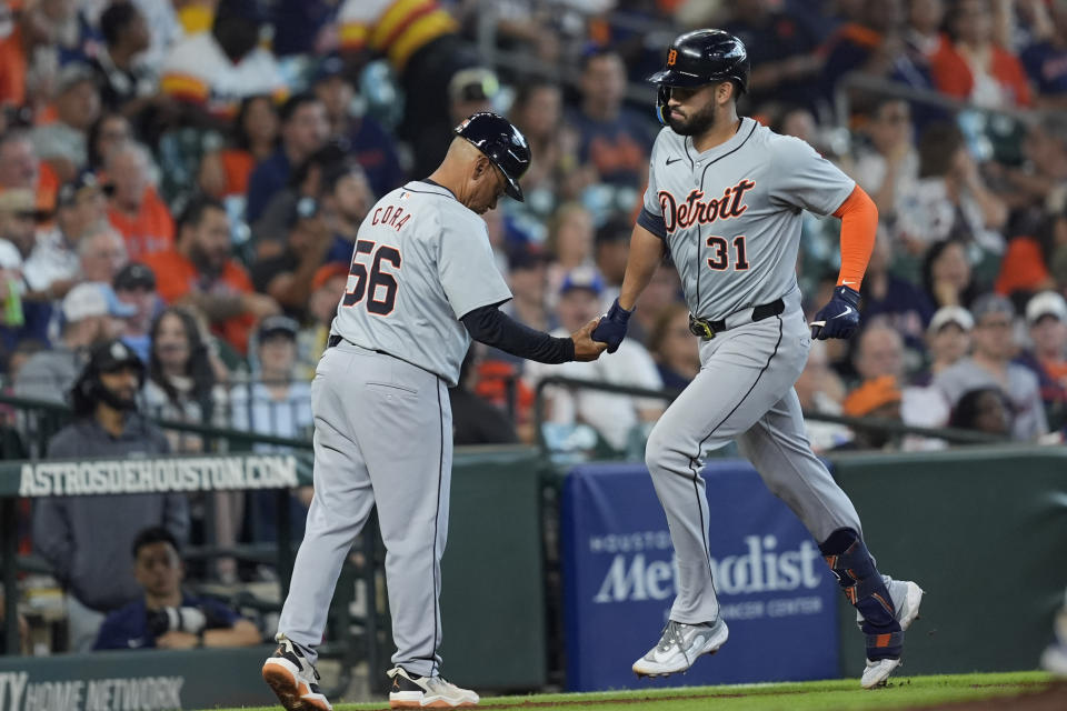 Detroit Tigers' Riley Greene (31) celebrates with third base coach Joey Cora (56) after hitting a three-run home run against the Houston Astros during the second inning of a baseball game Saturday, June 15, 2024, in Houston. (AP Photo/David J. Phillip)