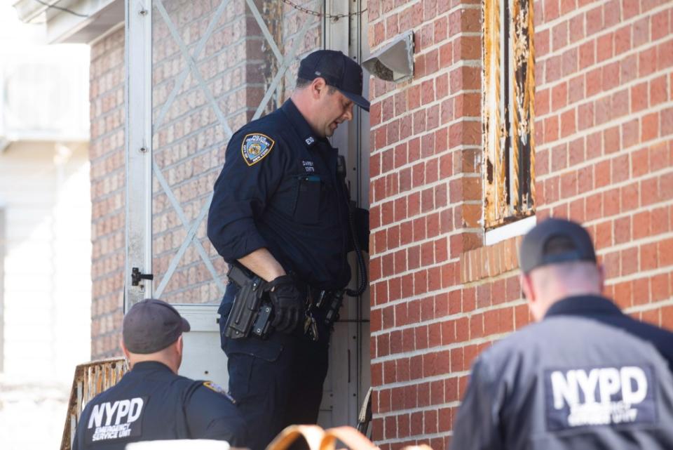 Police at the Flushing home owned by Adele Andalaro. She was arrested when she tried to kick the squatters out. James Messerschmidt