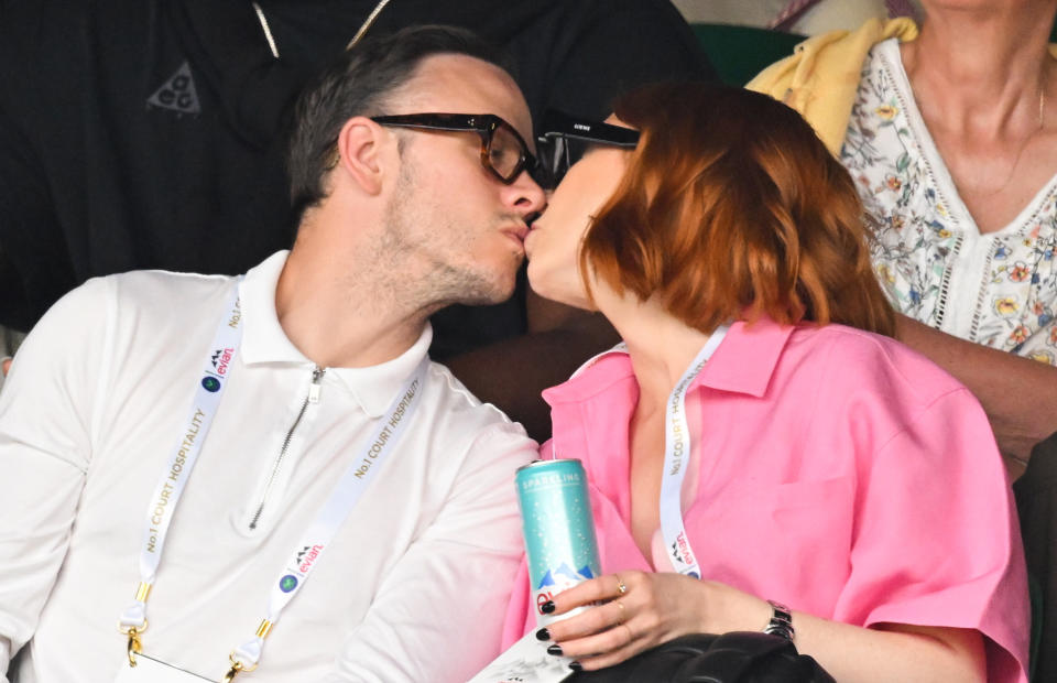 LONDON, ENGLAND - JUNE 27: Kevin Clifton and Stacey Dooley kiss as they attend Day One of Wimbledon 2022 at the All England Lawn Tennis and Croquet Club on June 27, 2022 in London, England. (Photo by Karwai Tang/WireImage)