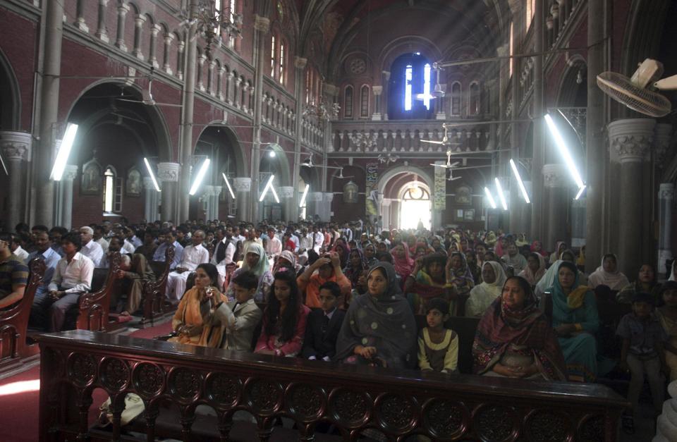 Christians attend Easter Mass at Sacred Heart Cathedral in Lahore, Pakistan, Sunday, April 20, 2014. Millions of Christians around the world celebrated Easter commemorating the day when according to Christian tradition Jesus was resurrected in Jerusalem two millennia ago. (AP Photo/K.M. Chaudary)