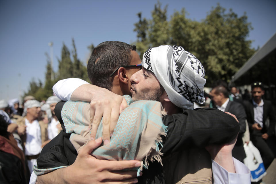 A Yemeni prisoner is greeted by his relative after being released by the Saudi-led coalition, at the airport in Sanaa, Yemen, Thursday, Oct. 15, 2020. (AP Photo/Hani Mohammed)