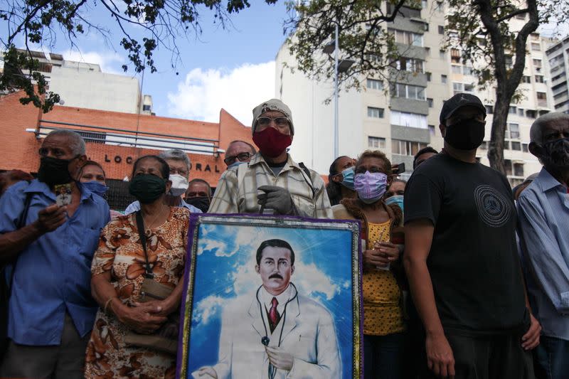 People gather outside of the Our Lady of La Candelaria church in Caracas