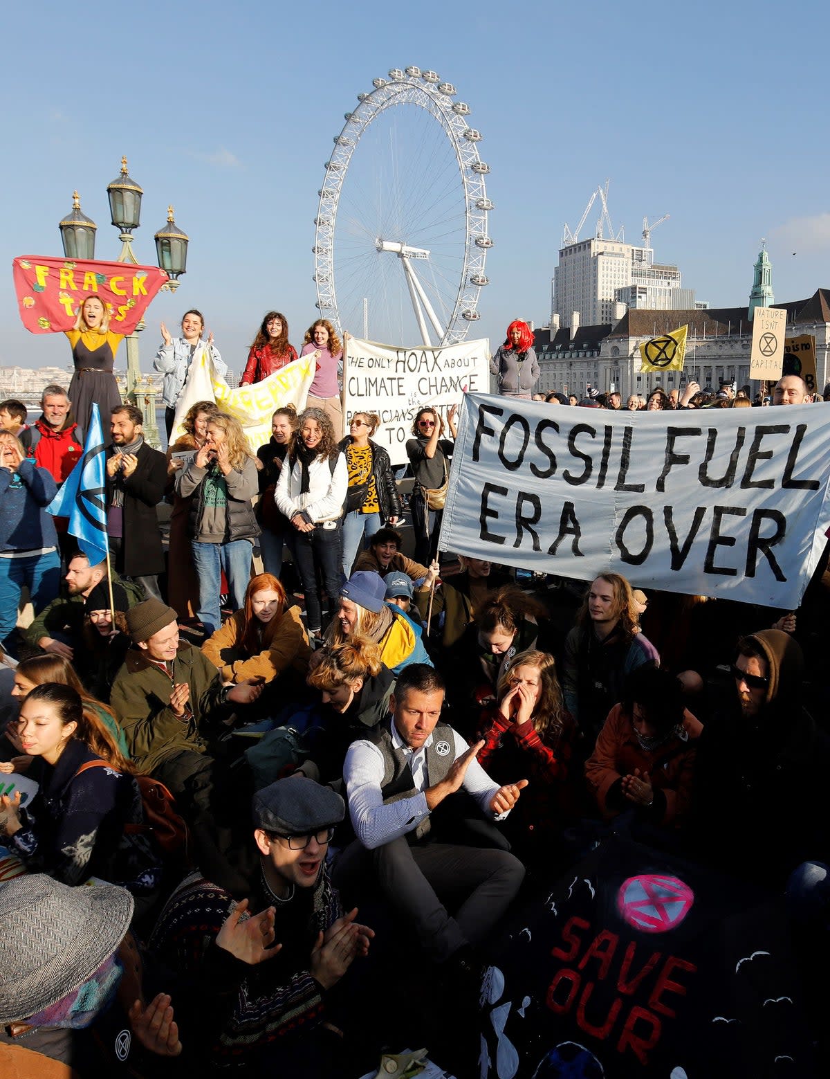 Demonstrators take part in a pro-environment protest as they block Westminster Bridge  (AFP via Getty Images)