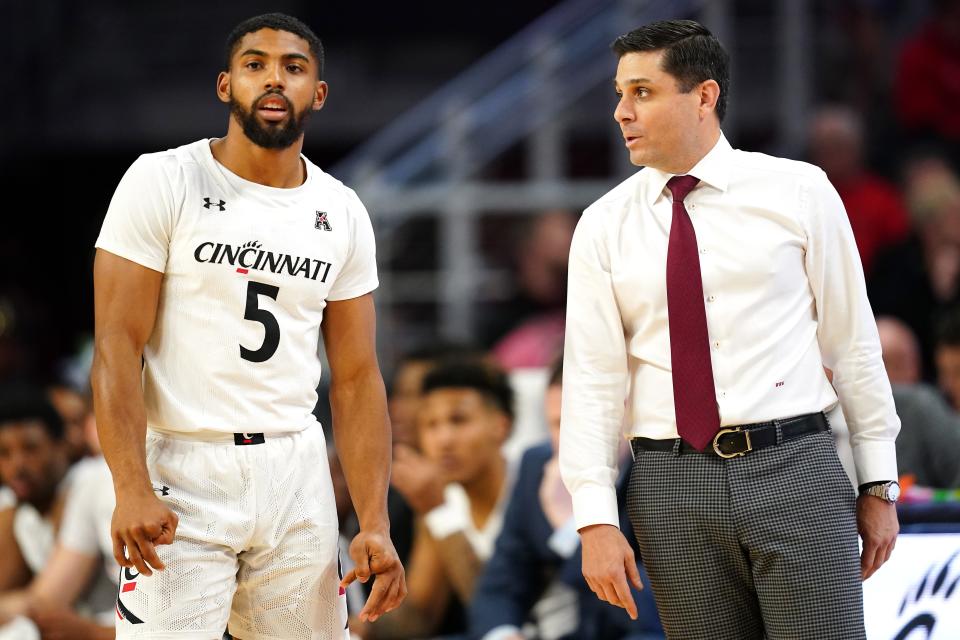 Cincinnati guard David DeJulius (5) and head coach Wes Miller will look to lead the Bearcats past Bryant on Sunday in their last test before the Crosstown Shootout on Dec. 10 against Xavier.