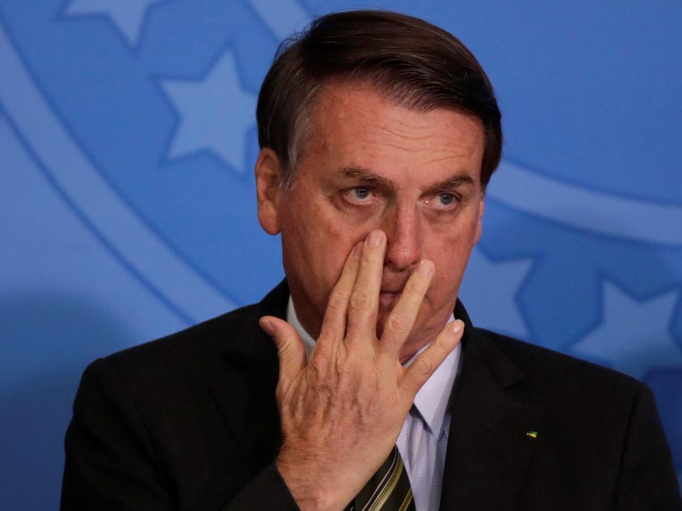 Brazil's President Jair Bolsonaro gestures during launch of the Green and Yellow program to create formal jobs for young people, at the Planalto Palace in Brasilia, Brazil November 11, 2019. REUTERS/Ueslei Marcelino