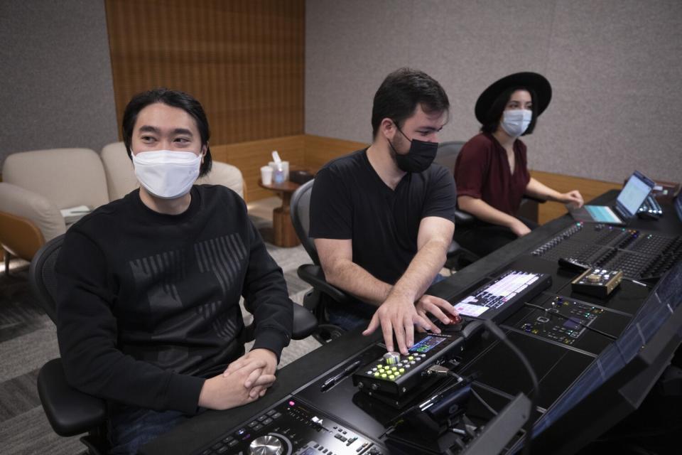 Director Kyung Sok Kim, left, engineer Yoav Litman and associate producer Anastasia Barbato.